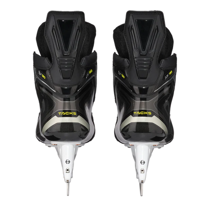 Pair of black hockey skates with white blades on a white background