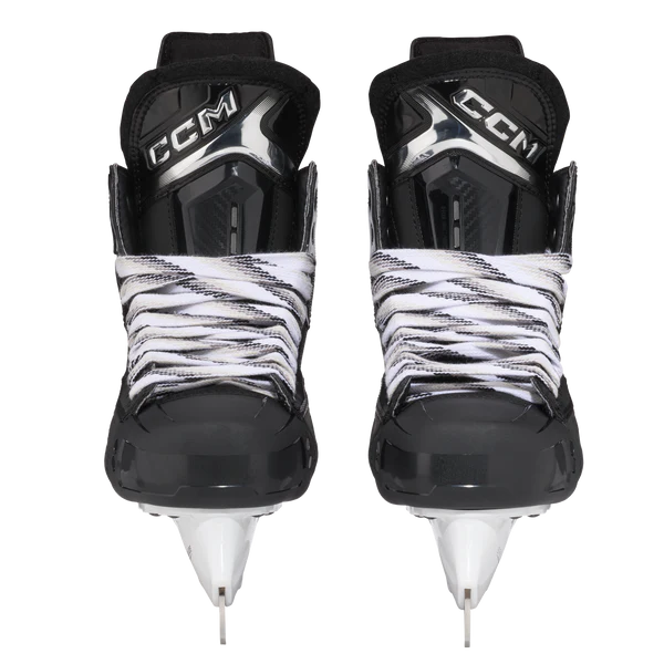Pair of CCM hockey skates with black and white design on a white background