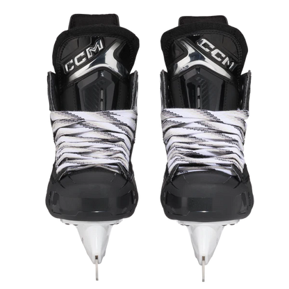 Pair of CCM hockey skates with black and white design on a white background