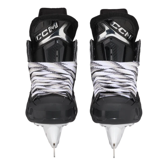Pair of CCM hockey skates with black and white design on a white background
